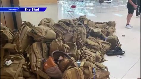 Volunteers at The Shul of Bal Harbour fill backpacks with supplies for soldiers of Israel